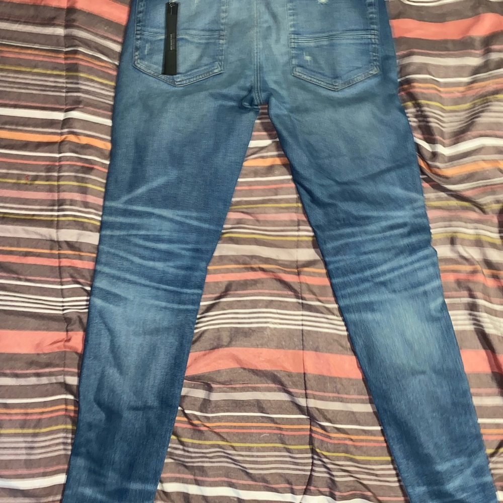 AMIRI Men's Relaxed Jeans in Blue